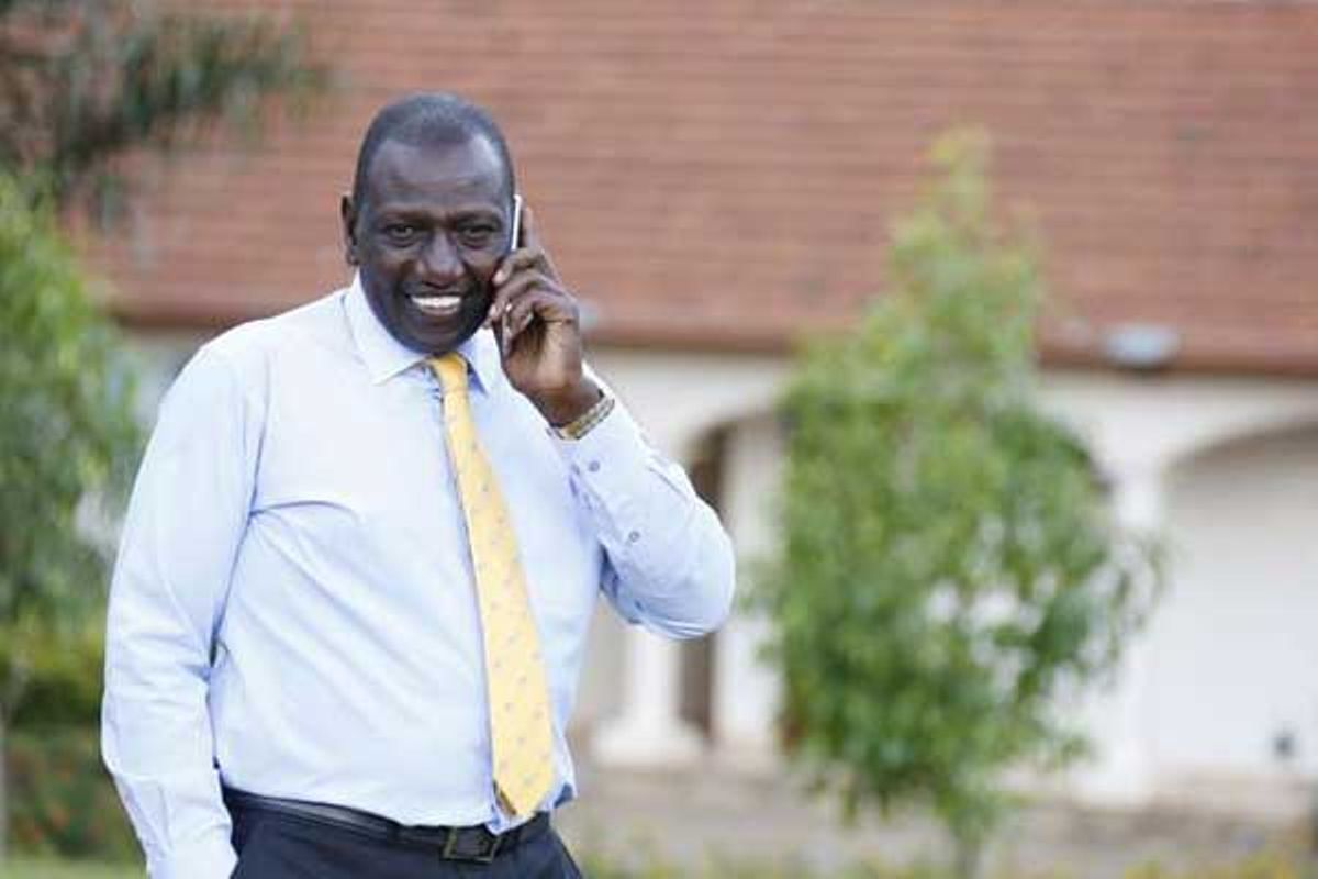 Image result for Ruto on Phone